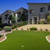 putting green area with apartment building in the background